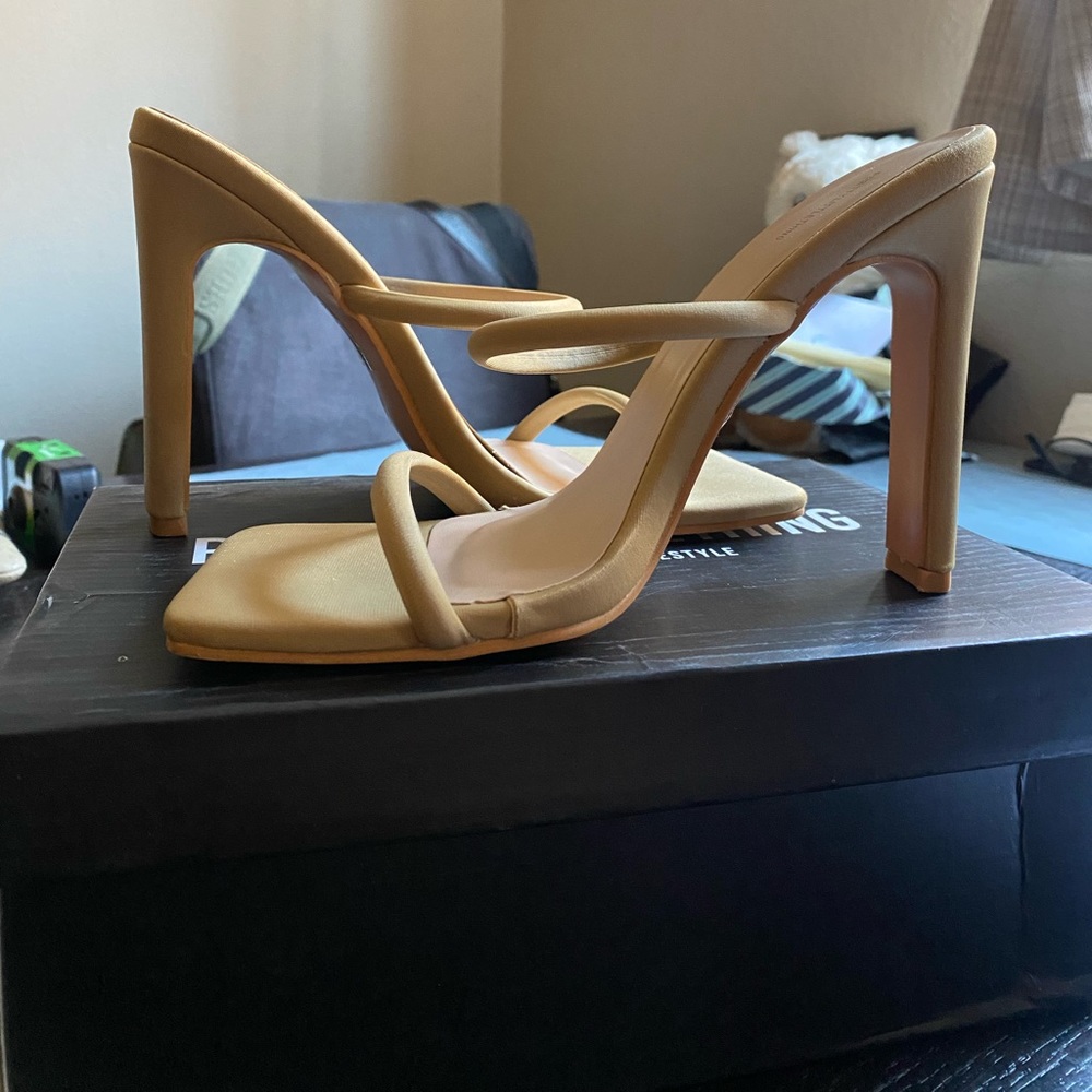 Nude color slip-on heels size 5. Heel is about 4 inches tall.